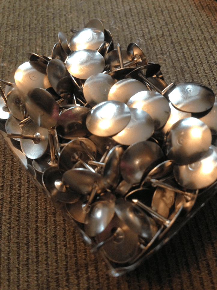 Pushpins in box